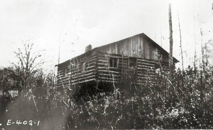 Side view of a log cabin style dwelling