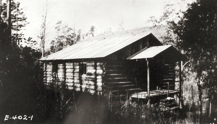 Front view of a log cabin style dwelling