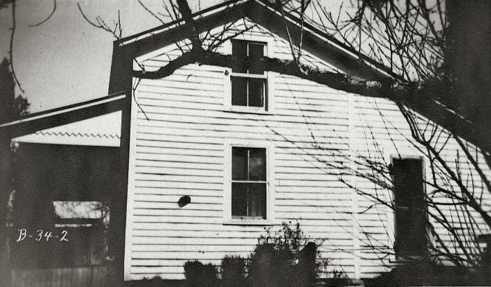 Old two story swelling with a side porch