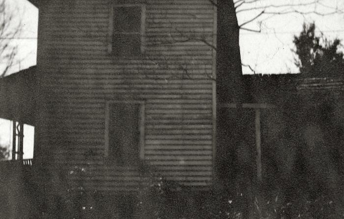 Two-story dwelling with a porch